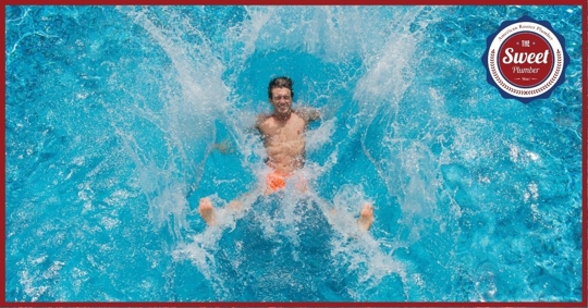 man plunging into pool